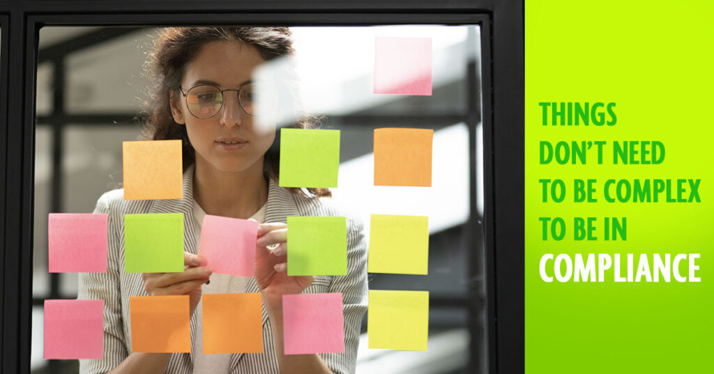 Social Ads Compliance Manager GRCAd 4 1200x628 1 Cybersecurity GRC: Align Security, Risk, and Compliance 6 Security Guides A woman places sticky notes on glass. Text reads, "THINGS DON'T NEED TO BE COMPLEX TO BE IN COMPLIANCE," with "COMPLIANCE" emphasized. Embrace Cybersecurity GRC for simplicity in meeting compliance needs.
